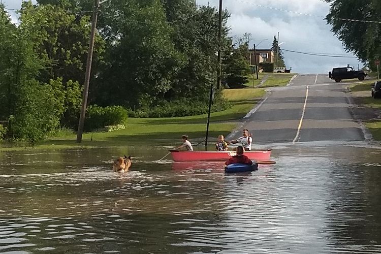 Quick storm floods Cochrane streets